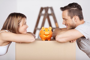 Young Couple looking at piggy bank